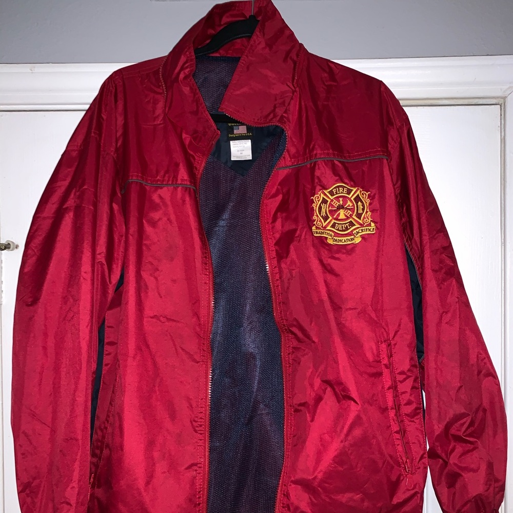 Red firefighter windbreaker.